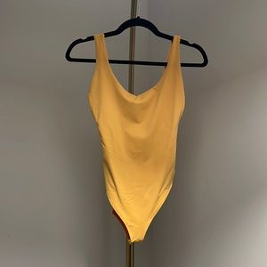 Yellow bodysuit
